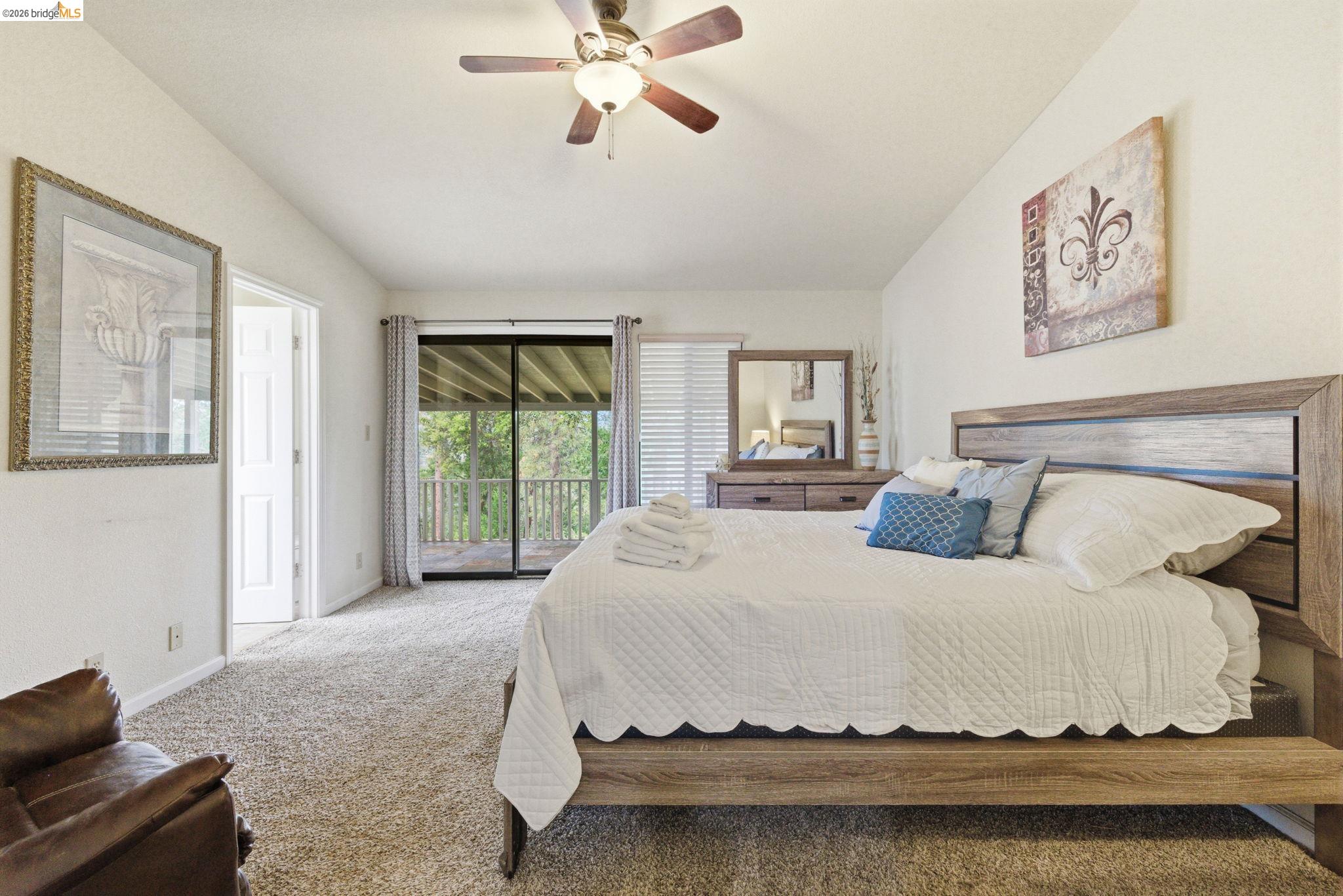 12068 Breckenridge Road Groveland, CA 95321 - Photo 11 of 55 Carpeted bedroom with access to outside, vaulted ceiling, and ceiling fan