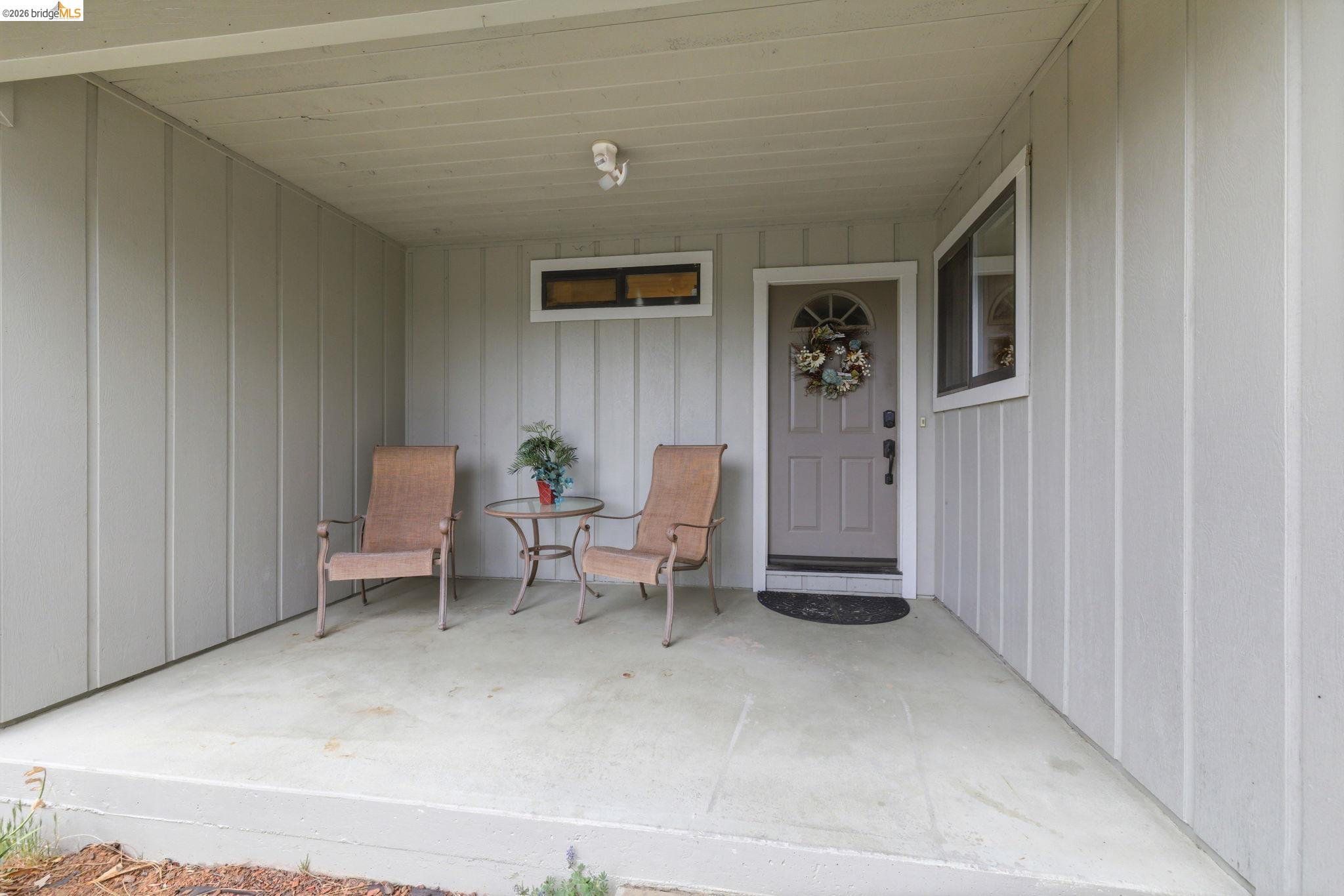 12068 Breckenridge Road Groveland, CA 95321 - Photo 12 of 55 Doorway to property with covered porch and board and batten siding