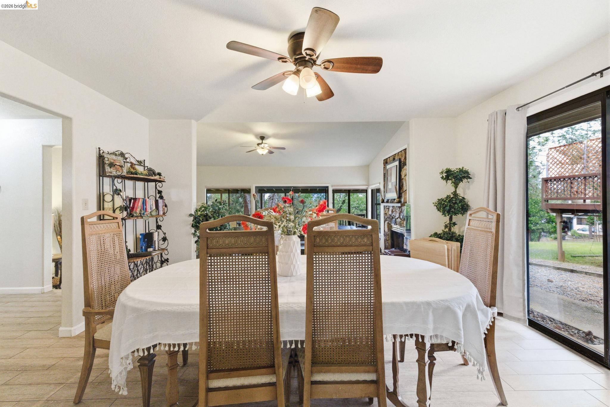 12068 Breckenridge Road Groveland, CA 95321 - Photo 17 of 55 Dining room featuring a ceiling fan and lofted ceiling