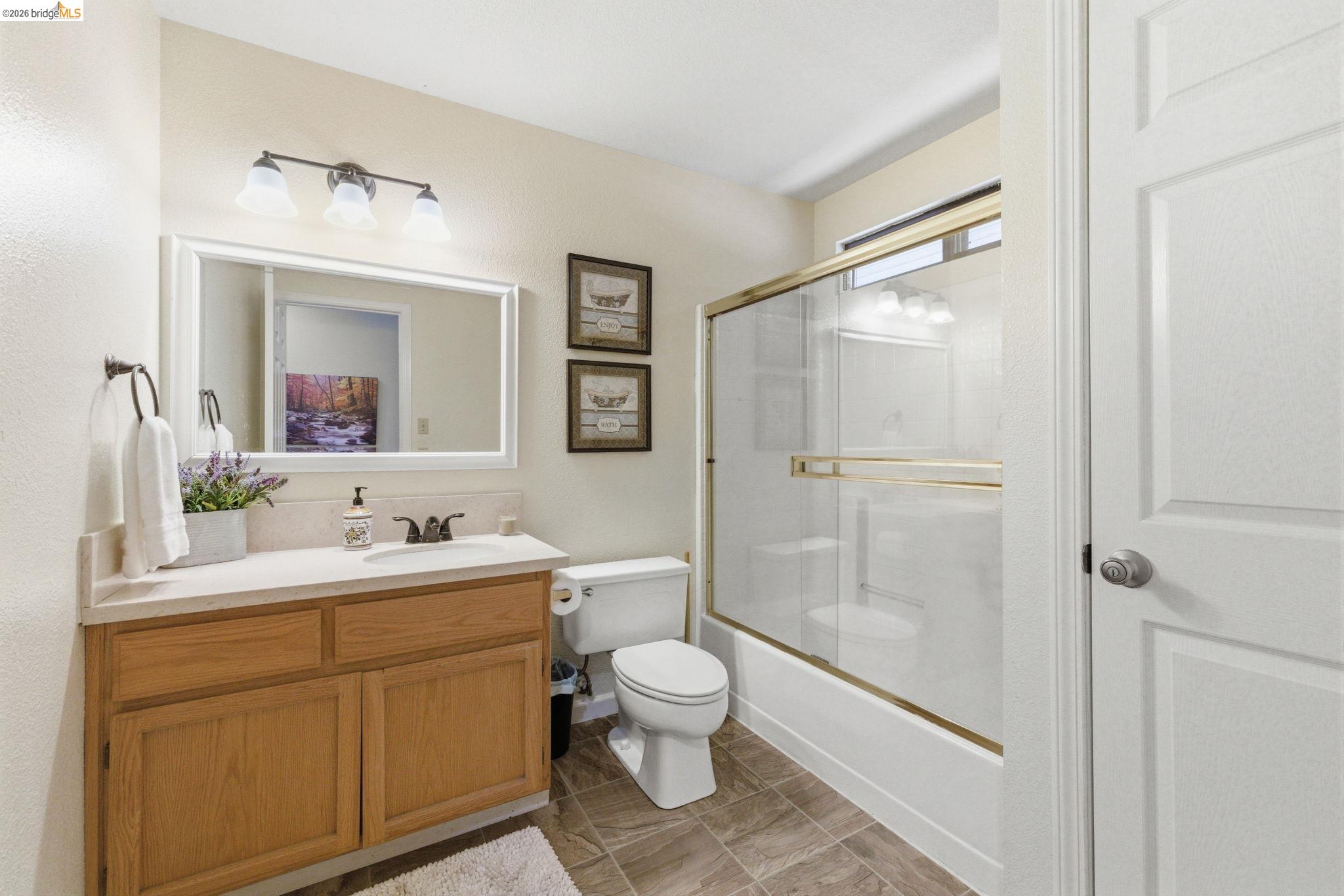12068 Breckenridge Road Groveland, CA 95321 - Photo 23 of 55 Full bath featuring vanity and bath / shower combo with glass door