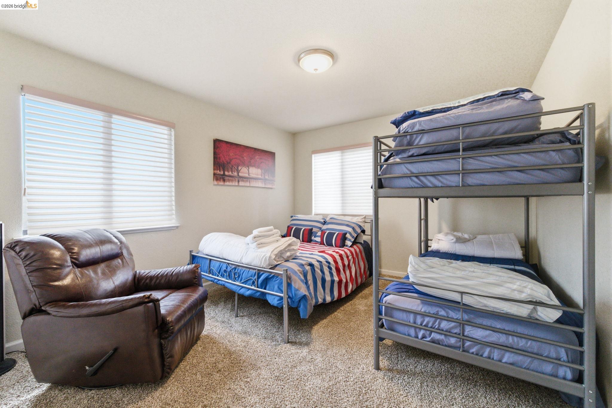 12068 Breckenridge Road Groveland, CA 95321 - Photo 23 of 55 a bedroom with furniture and a window