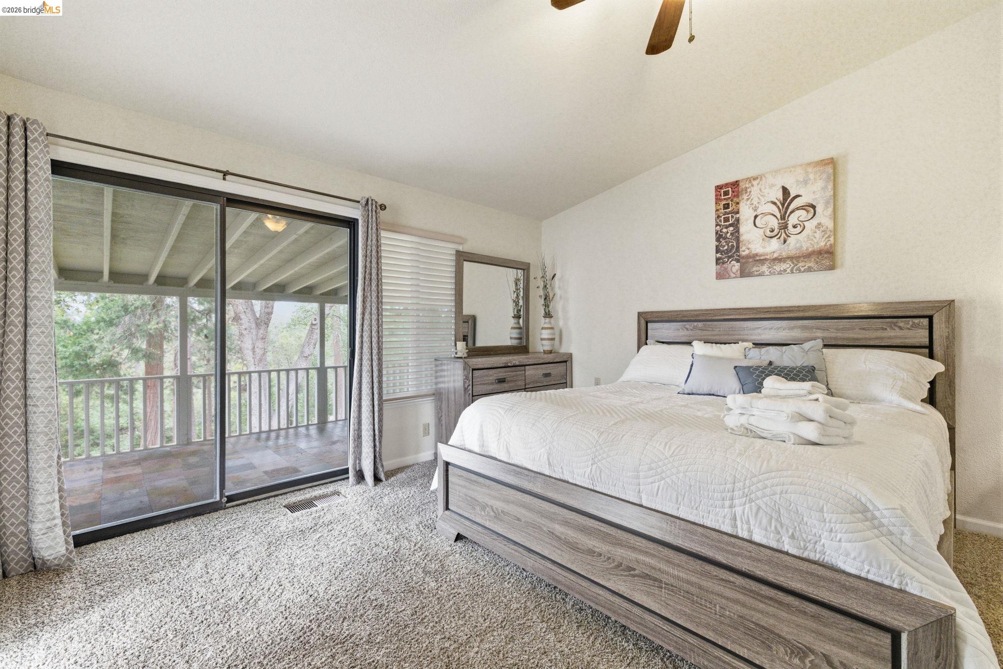12068 Breckenridge Road Groveland, CA 95321 - Photo 25 of 55 Bedroom featuring carpet, access to outside, lofted ceiling, and a ceiling fan