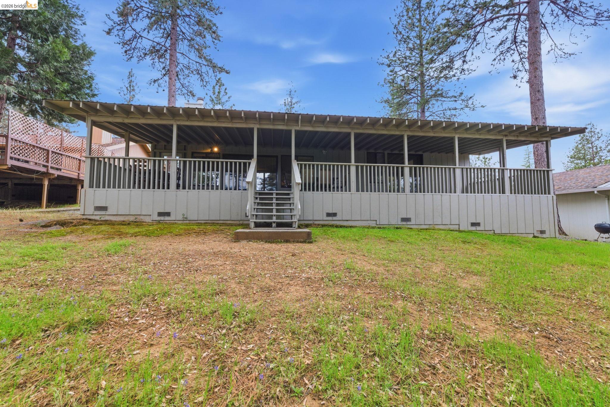 12068 Breckenridge Road Groveland, CA 95321 - Photo 28 of 55 Back of property featuring crawl space and a lawn