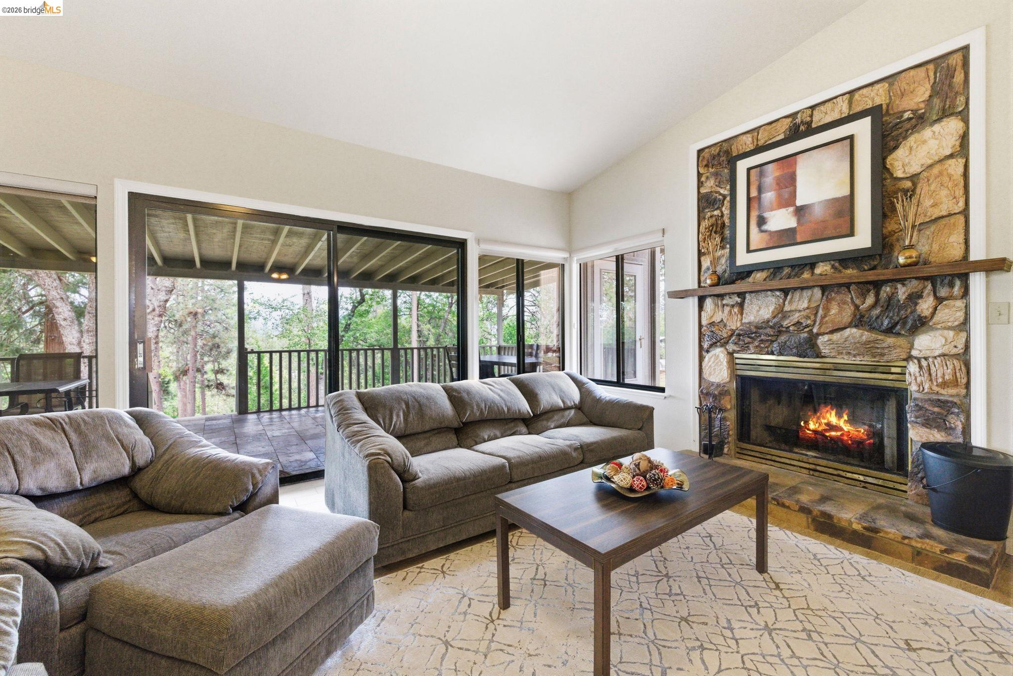 12068 Breckenridge Road Groveland, CA 95321 - Photo 3 of 55 Living room with a fireplace and vaulted ceiling