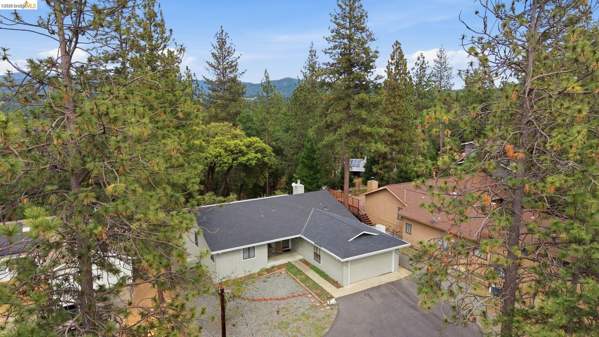 12068 Breckenridge Road Groveland, CA 95321 - Photo 32 of 55 View of subject property with a mountainous background
