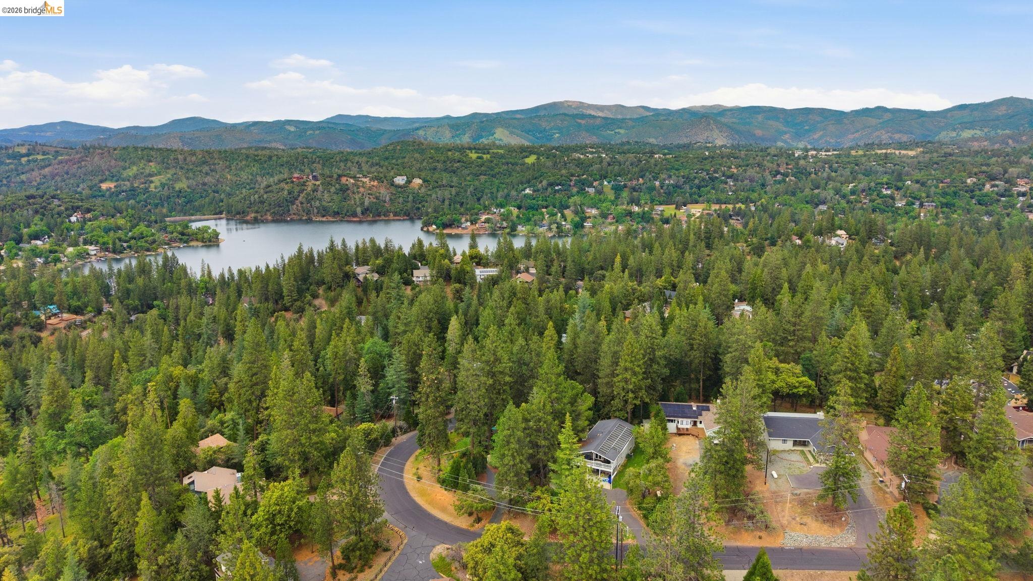 12068 Breckenridge Road Groveland, CA 95321 - Photo 37 of 55 Bird's eye view of a forest and a water and mountain view