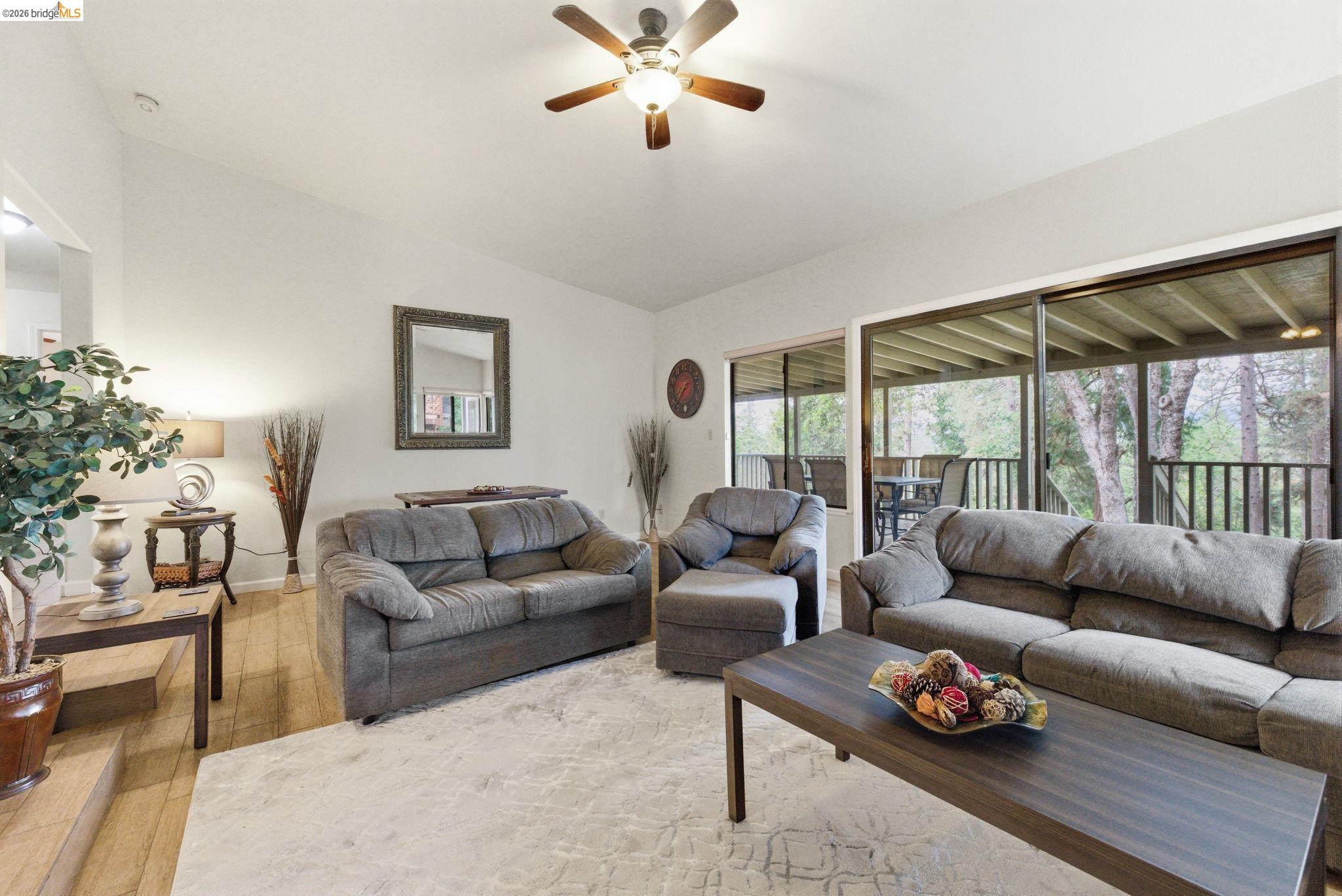 12068 Breckenridge Road Groveland, CA 95321 - Photo 5 of 55 Living area featuring wood-type flooring, ceiling fan, and vaulted ceiling