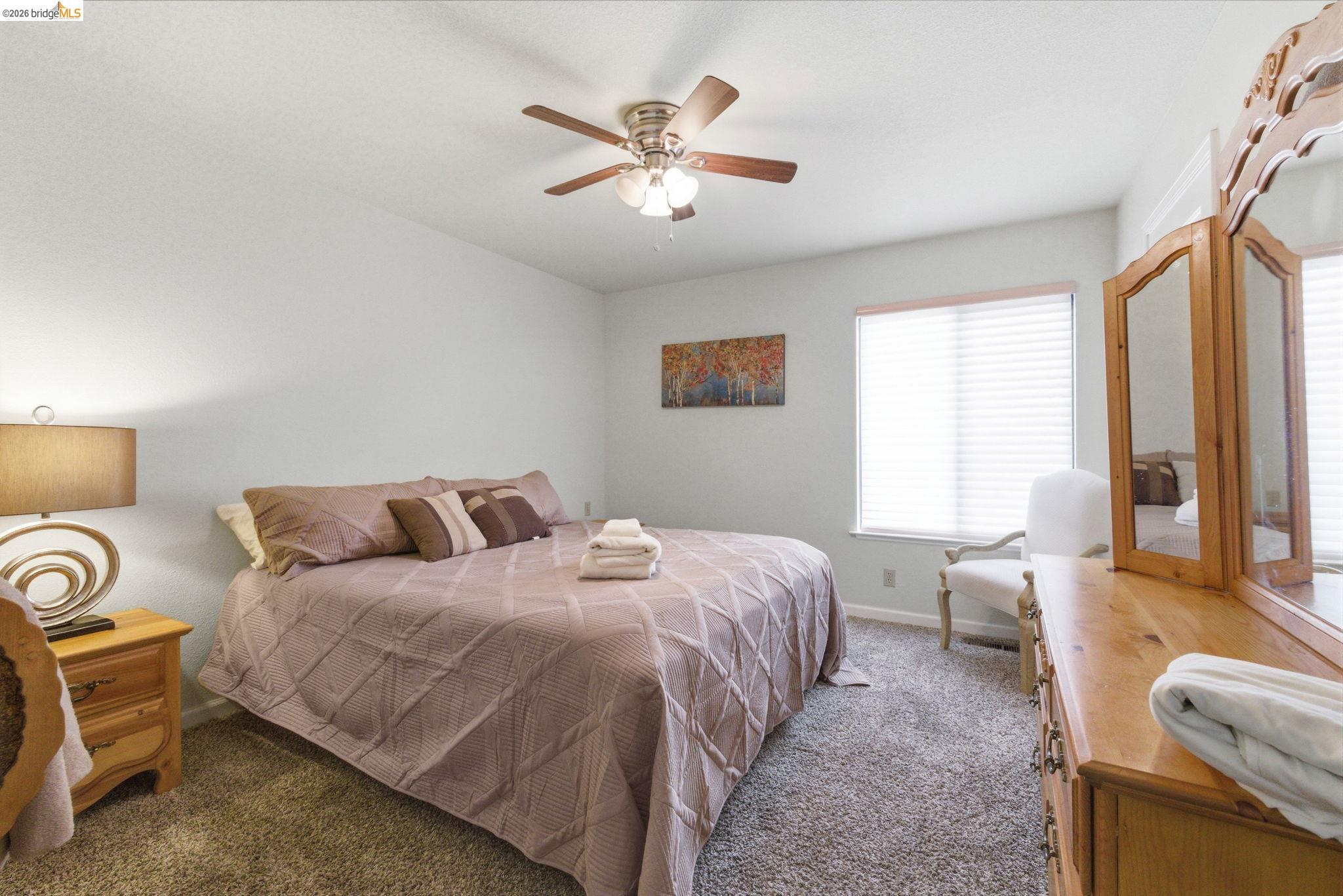 12068 Breckenridge Road Groveland, CA 95321 - Photo 10 of 55 Bedroom with dark colored carpet and ceiling fan