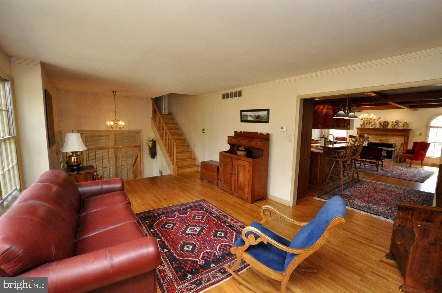 208 Ridge Road Southampton, NJ 08088 - Photo 12 of 34 a living room with furniture a dining table and a large window