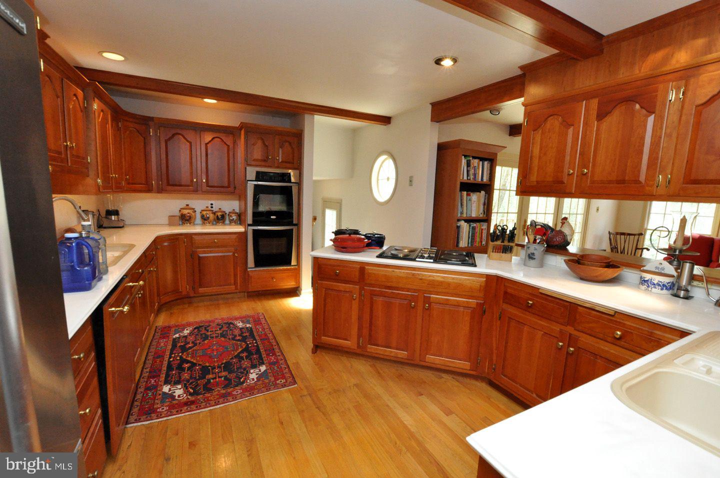 208 Ridge Road Southampton, NJ 08088 - Photo 14 of 34 a large kitchen with stainless steel appliances kitchen island granite countertop a sink dishwasher stove and cabinets