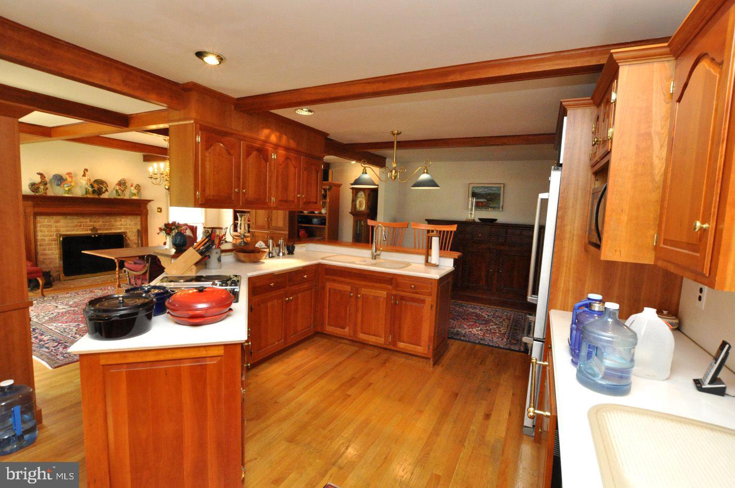 208 Ridge Road Southampton, NJ 08088 - Photo 17 of 34 a kitchen with a sink stove and cabinets