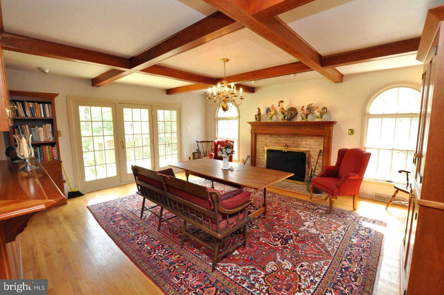 208 Ridge Road Southampton, NJ 08088 - Photo 19 of 34 a living room with furniture a fireplace and a large window