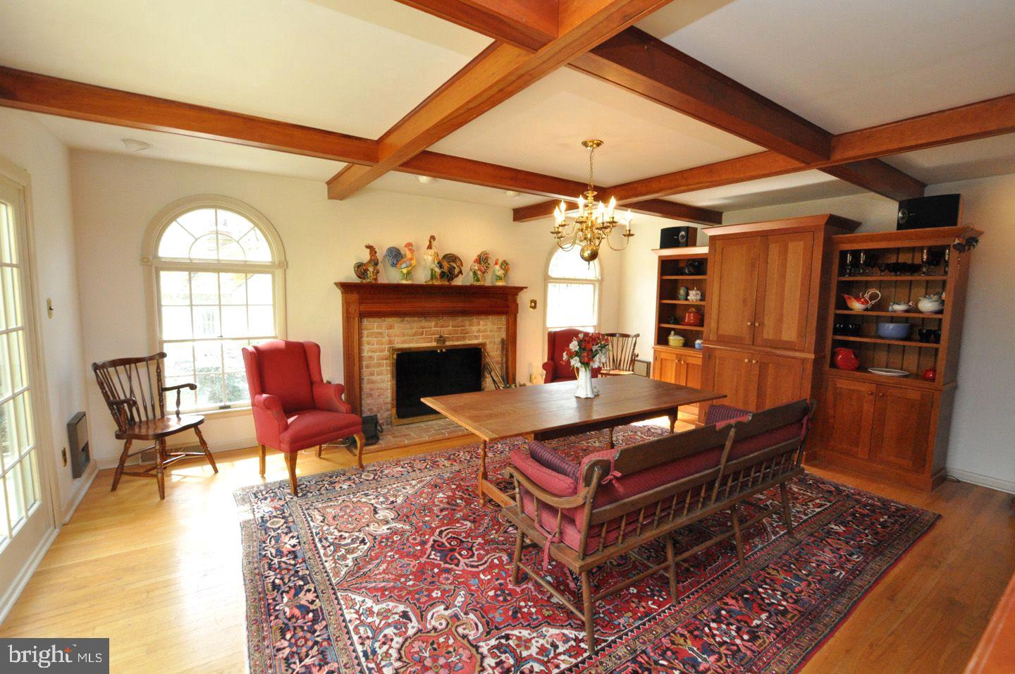 208 Ridge Road Southampton, NJ 08088 - Photo 20 of 34 a living room with furniture a fireplace and a table