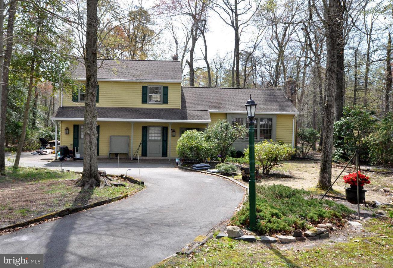208 Ridge Road Southampton, NJ 08088 - Photo 3 of 34 a front view of a house with a yard and tree s