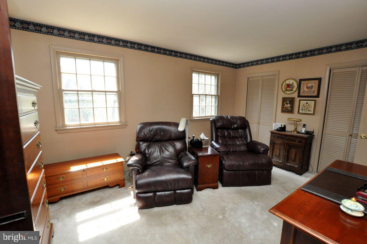 208 Ridge Road Southampton, NJ 08088 - Photo 23 of 34 a living room with furniture window and a flat screen tv