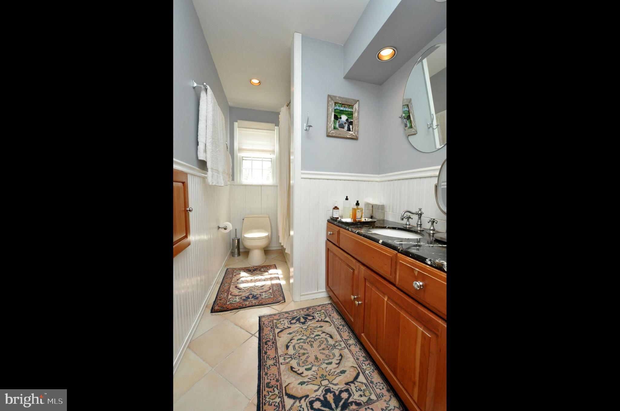 208 Ridge Road Southampton, NJ 08088 - Photo 25 of 34 a kitchen with granite countertop a sink and cabinets
