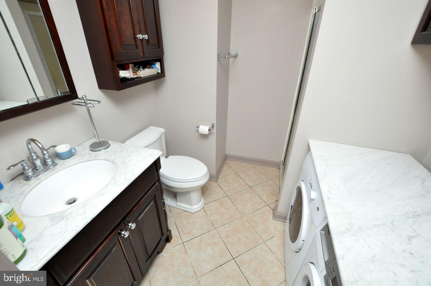 208 Ridge Road Southampton, NJ 08088 - Photo 26 of 34 a bathroom with a sink a toilet and a mirror