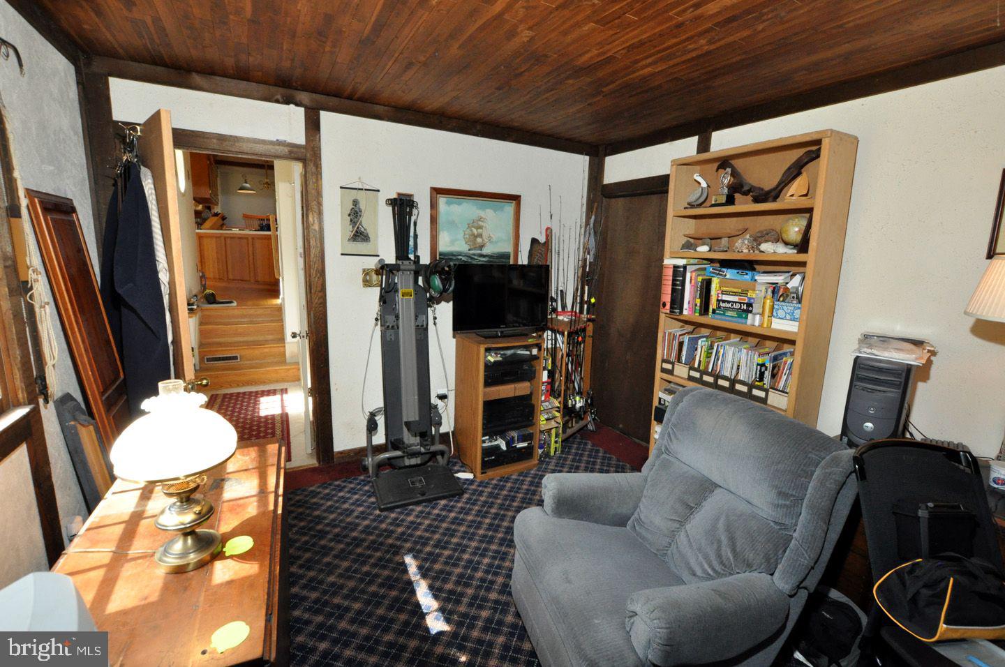 208 Ridge Road Southampton, NJ 08088 - Photo 29 of 34 a living room with furniture and a flat screen tv