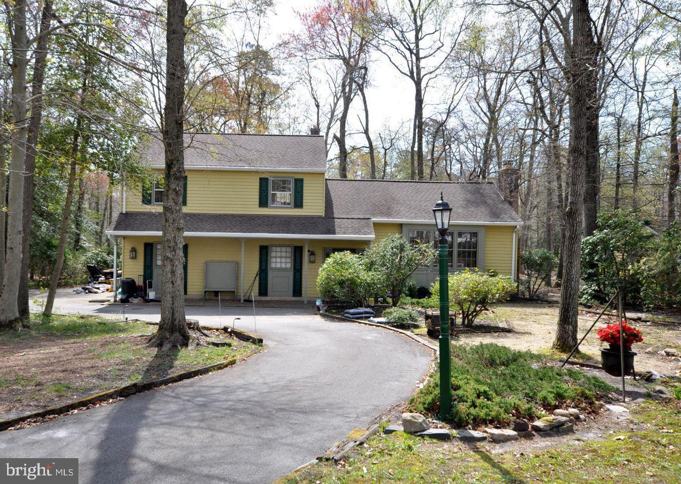 208 Ridge Road Southampton, NJ 08088 - Photo 4 of 34 a front view of a house with garden