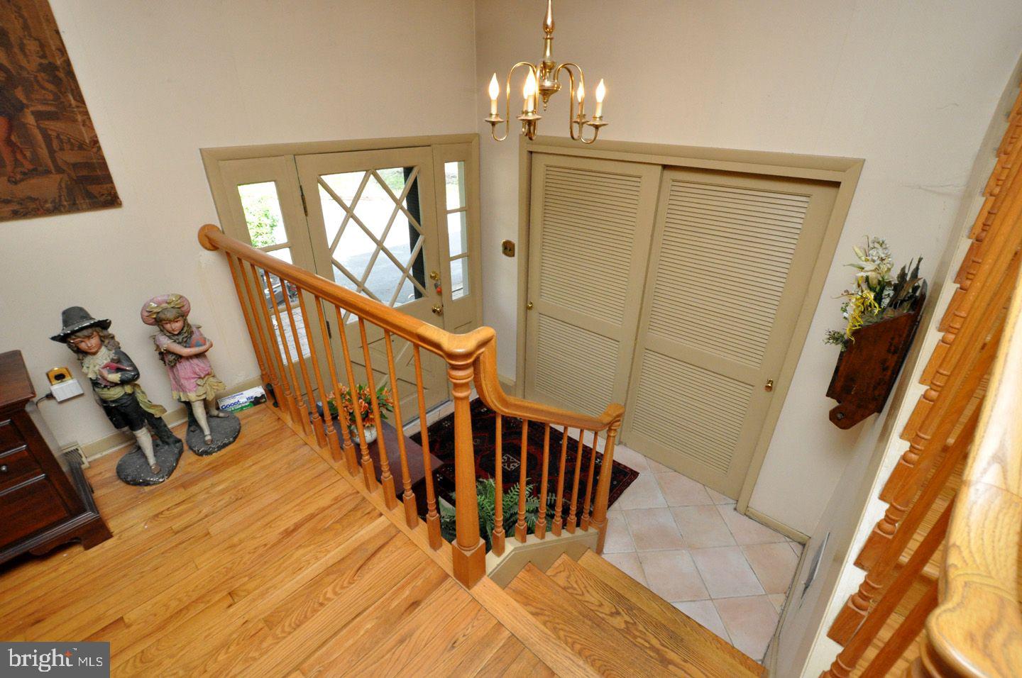 208 Ridge Road Southampton, NJ 08088 - Photo 9 of 34 a view of a livingroom with wooden floor and stairs