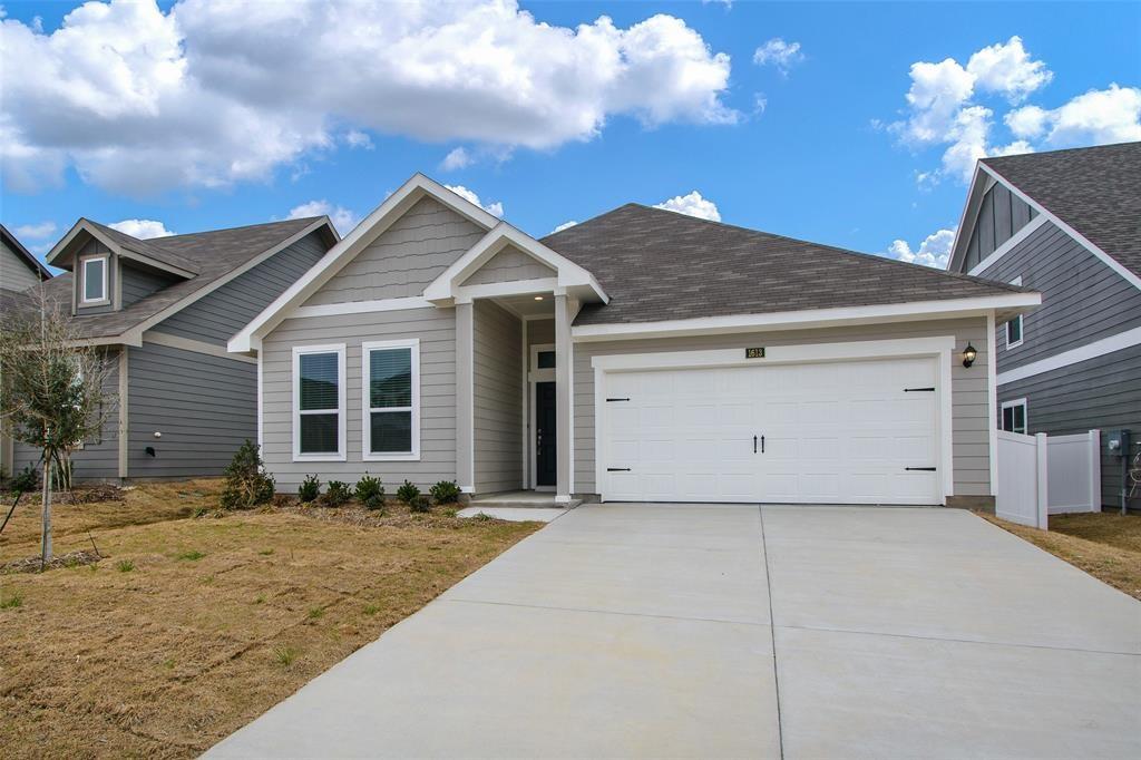 1613 Abbottsford Avenue Providence Village, TX 76227 - Photo 1 of 14 a front view of a house with a yard