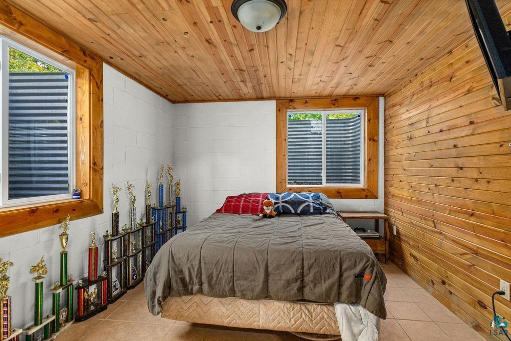 5466 Jean Duluth Road Duluth, MN 55803 - Photo 15 of 34 Wood-paneled ceiling and a wood-paneled accent wall provide warmth