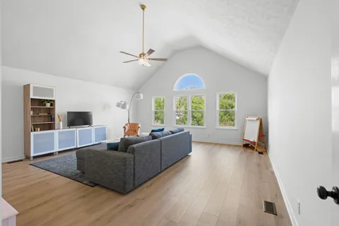 a living room with furniture and a large window