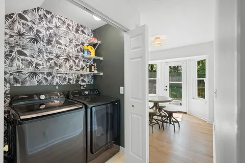 a kitchen with a stove and a table