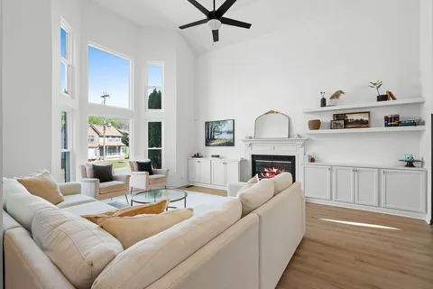 a living room with furniture and a fireplace