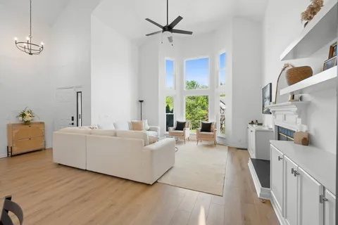 a living room with furniture and a fireplace