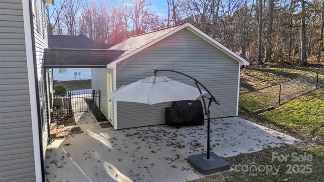 a view of empty room with wooden floor and window