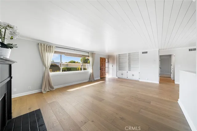 a kitchen with a sink a counter top space and stainless steel appliances