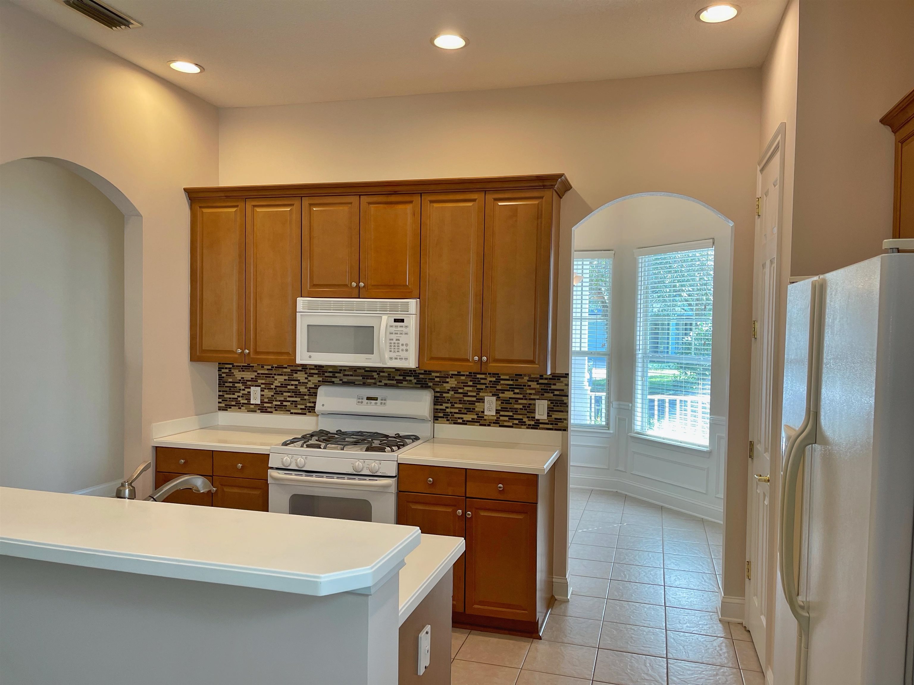 157 West Village Drive St. Augustine, FL 32095 - Photo 12 of 43 a kitchen with a sink cabinets and wooden floor