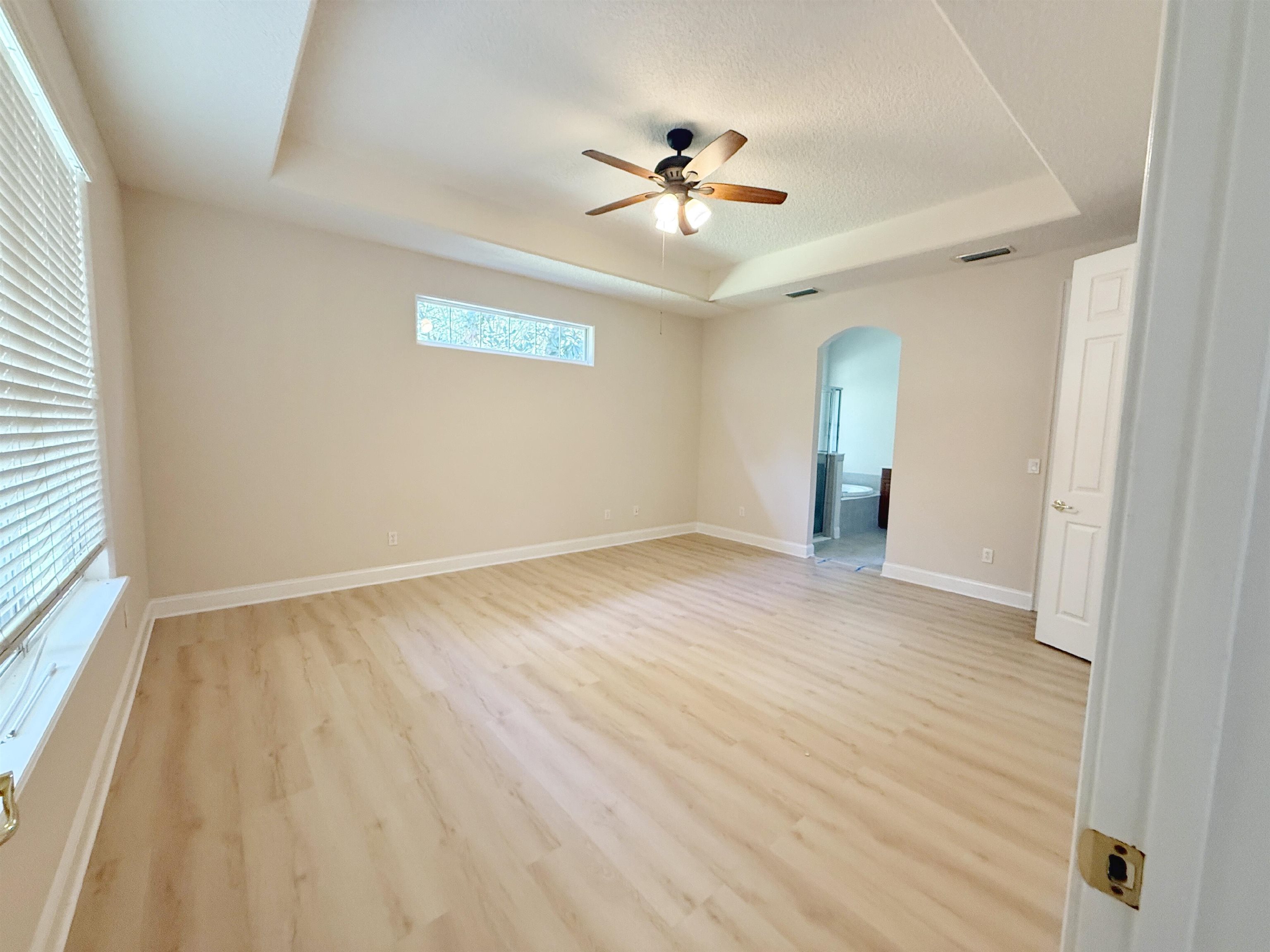 157 West Village Drive St. Augustine, FL 32095 - Photo 13 of 43 wooden floor in an empty room with a window