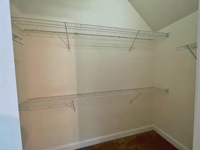 a view of a room with racks on the wall