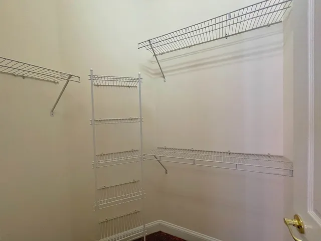 a view of a room with racks on the wall