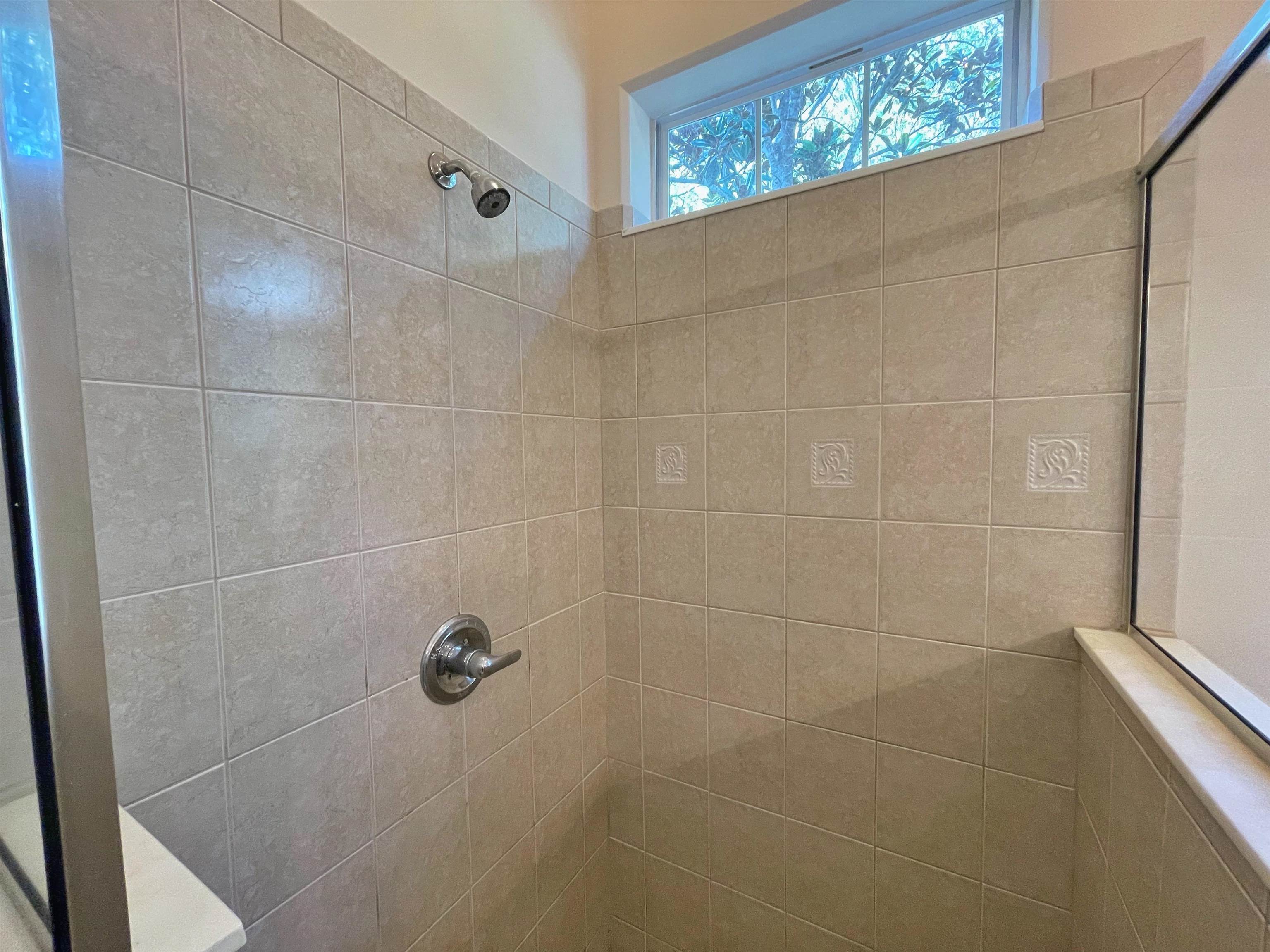 157 West Village Drive St. Augustine, FL 32095 - Photo 19 of 43 a bathroom with a shower