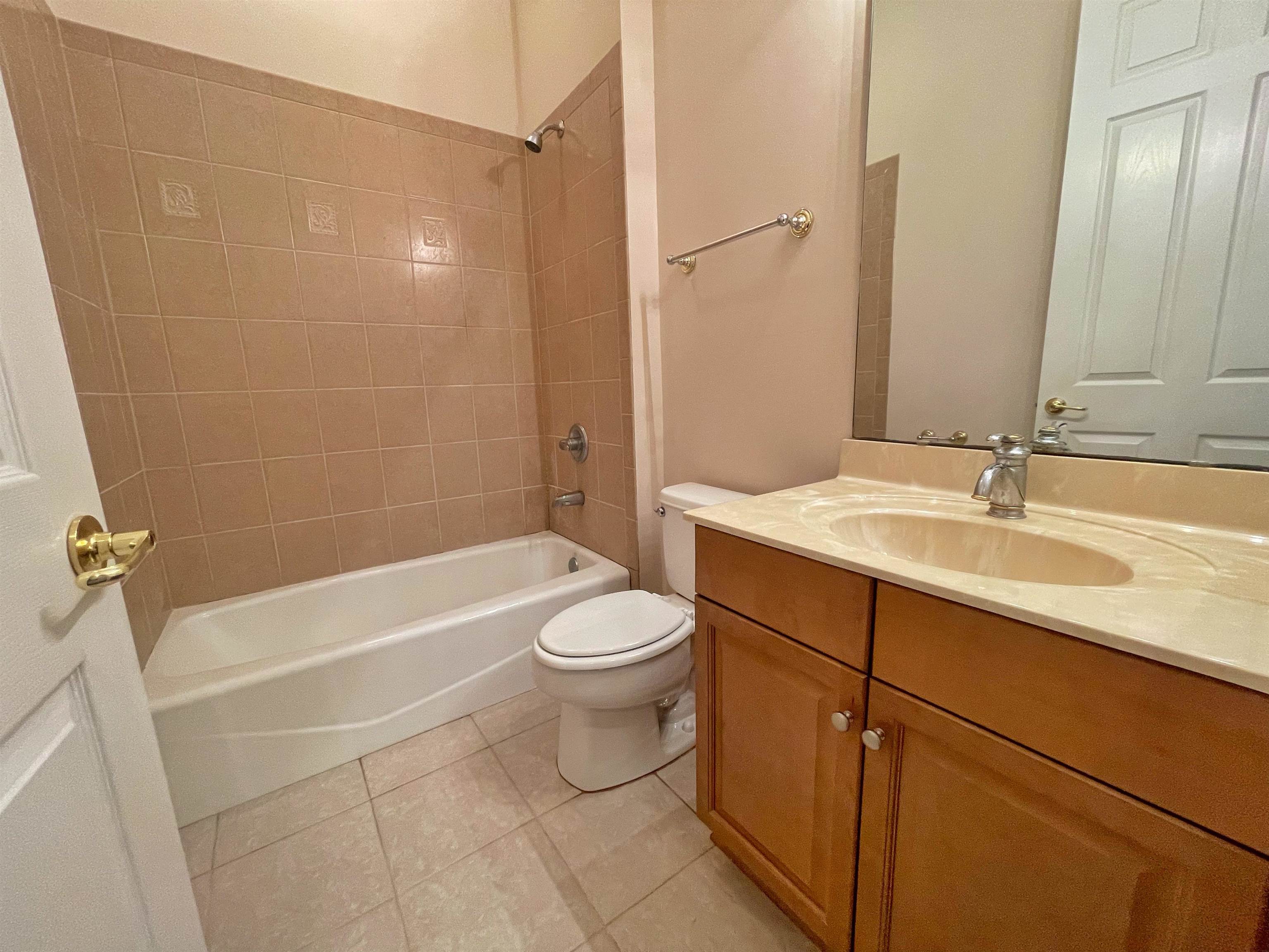 157 West Village Drive St. Augustine, FL 32095 - Photo 24 of 43 a bathroom with a sink a toilet and shower