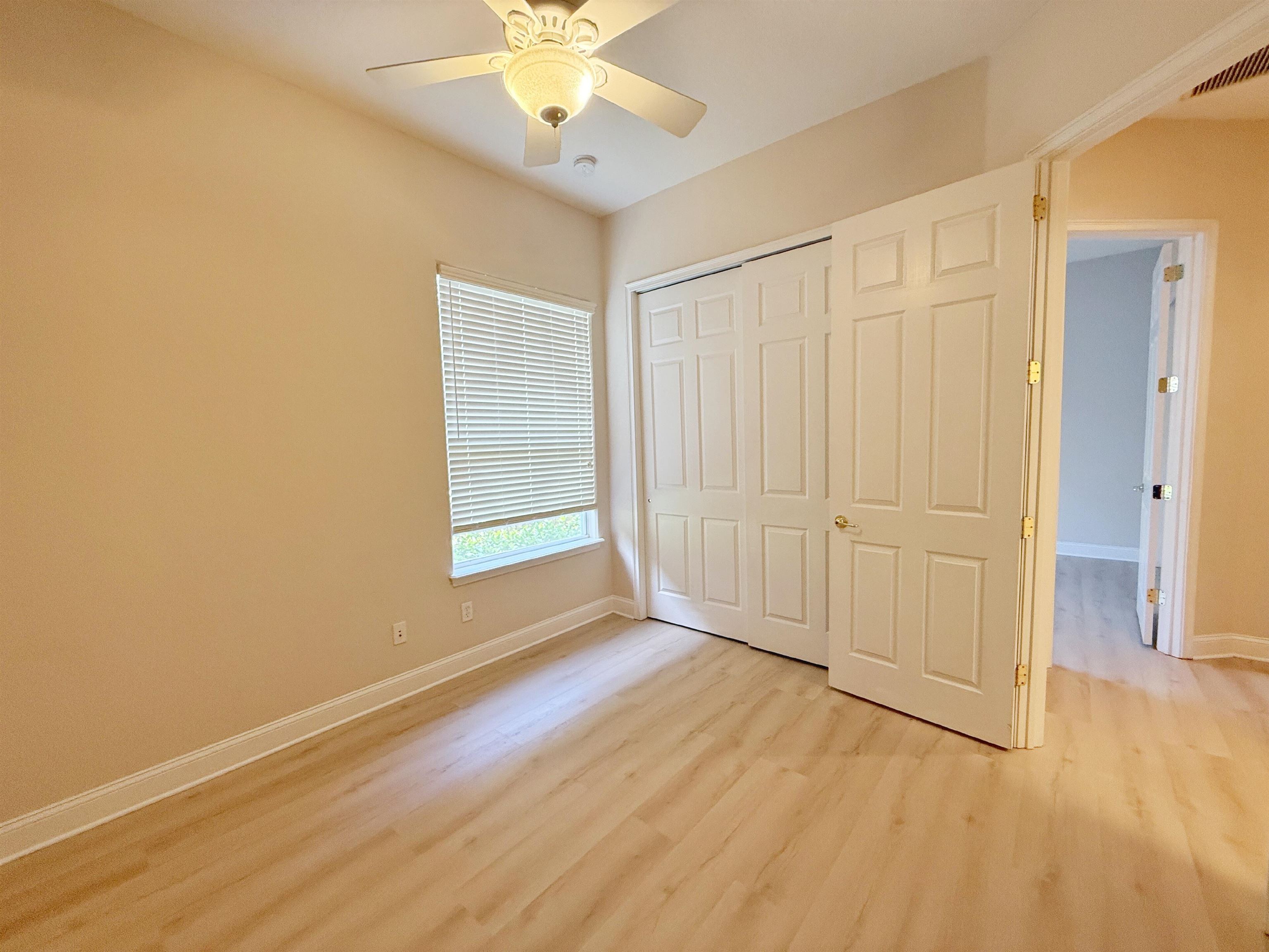 157 West Village Drive St. Augustine, FL 32095 - Photo 26 of 43 a view of an empty room with wooden floor