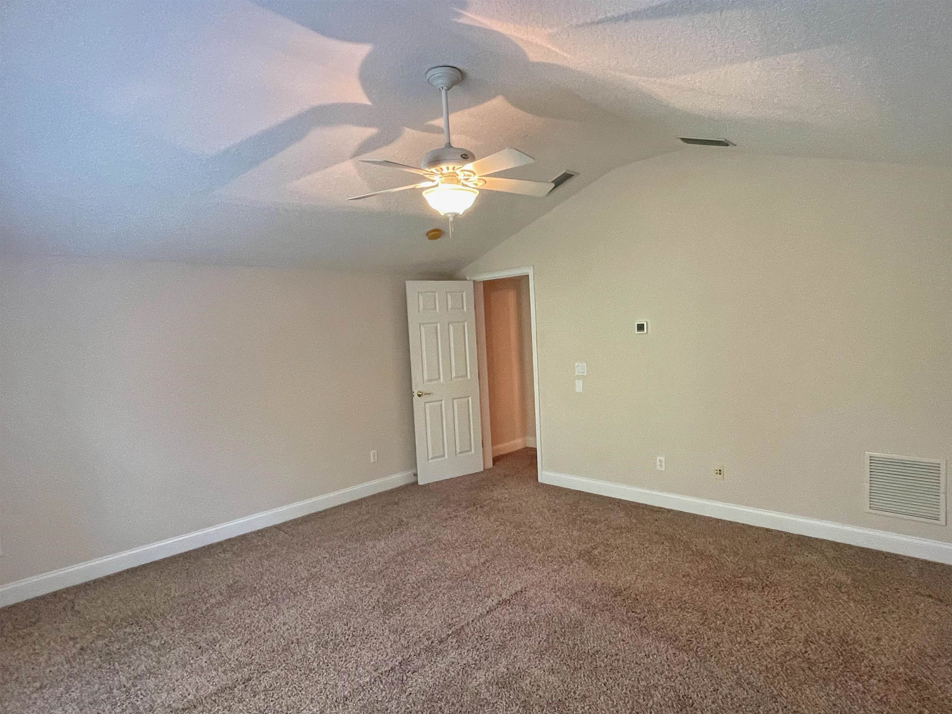 157 West Village Drive St. Augustine, FL 32095 - Photo 28 of 43 a view of an empty room with a fan