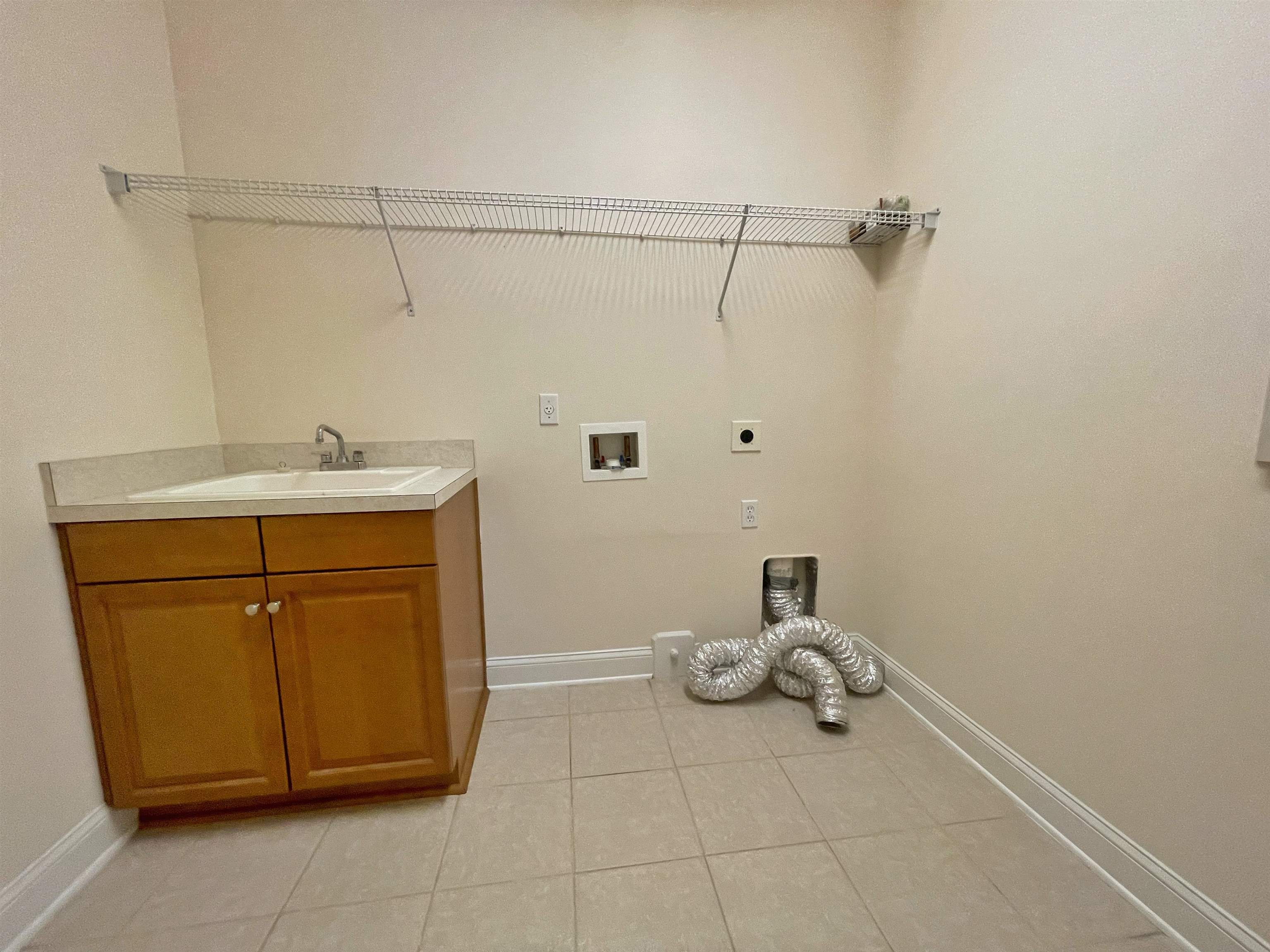 157 West Village Drive St. Augustine, FL 32095 - Photo 30 of 43 a bathroom with a sink and a mirror