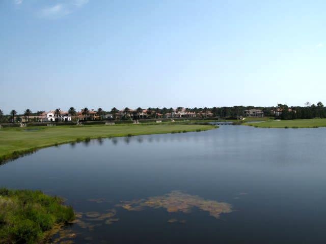 157 West Village Drive St. Augustine, FL 32095 - Photo 40 of 43 a view of a lake with houses in the back