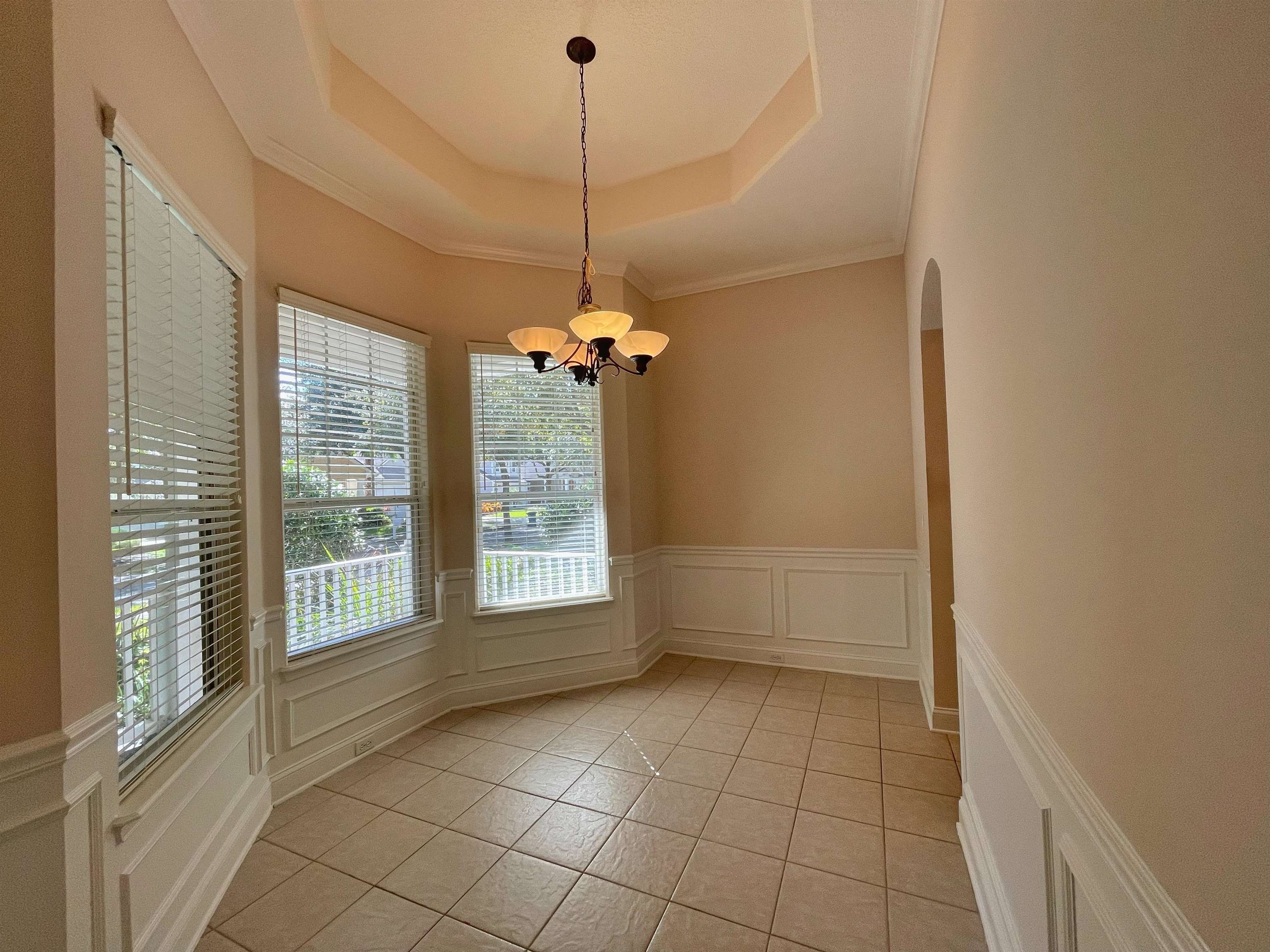 157 West Village Drive St. Augustine, FL 32095 - Photo 4 of 43 a view of an empty room with a window