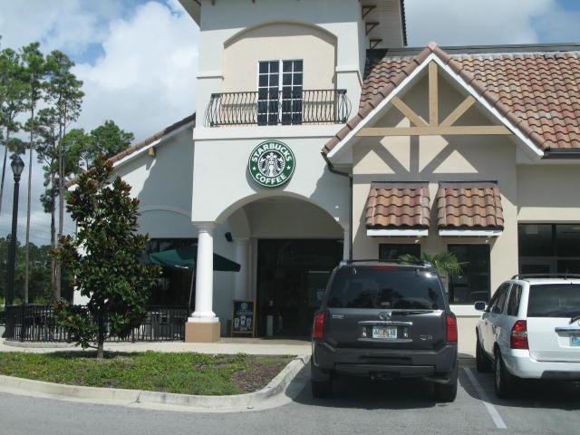 157 West Village Drive St. Augustine, FL 32095 - Photo 43 of 43 a front view of a house with garden