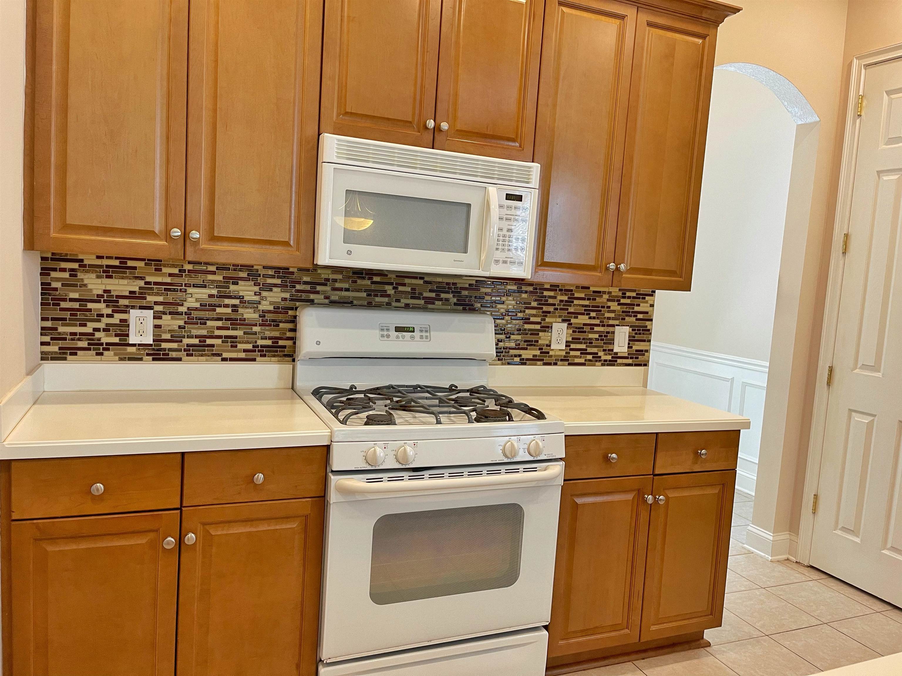 157 West Village Drive St. Augustine, FL 32095 - Photo 10 of 43 a kitchen with granite countertop cabinets stainless steel appliances and a sink