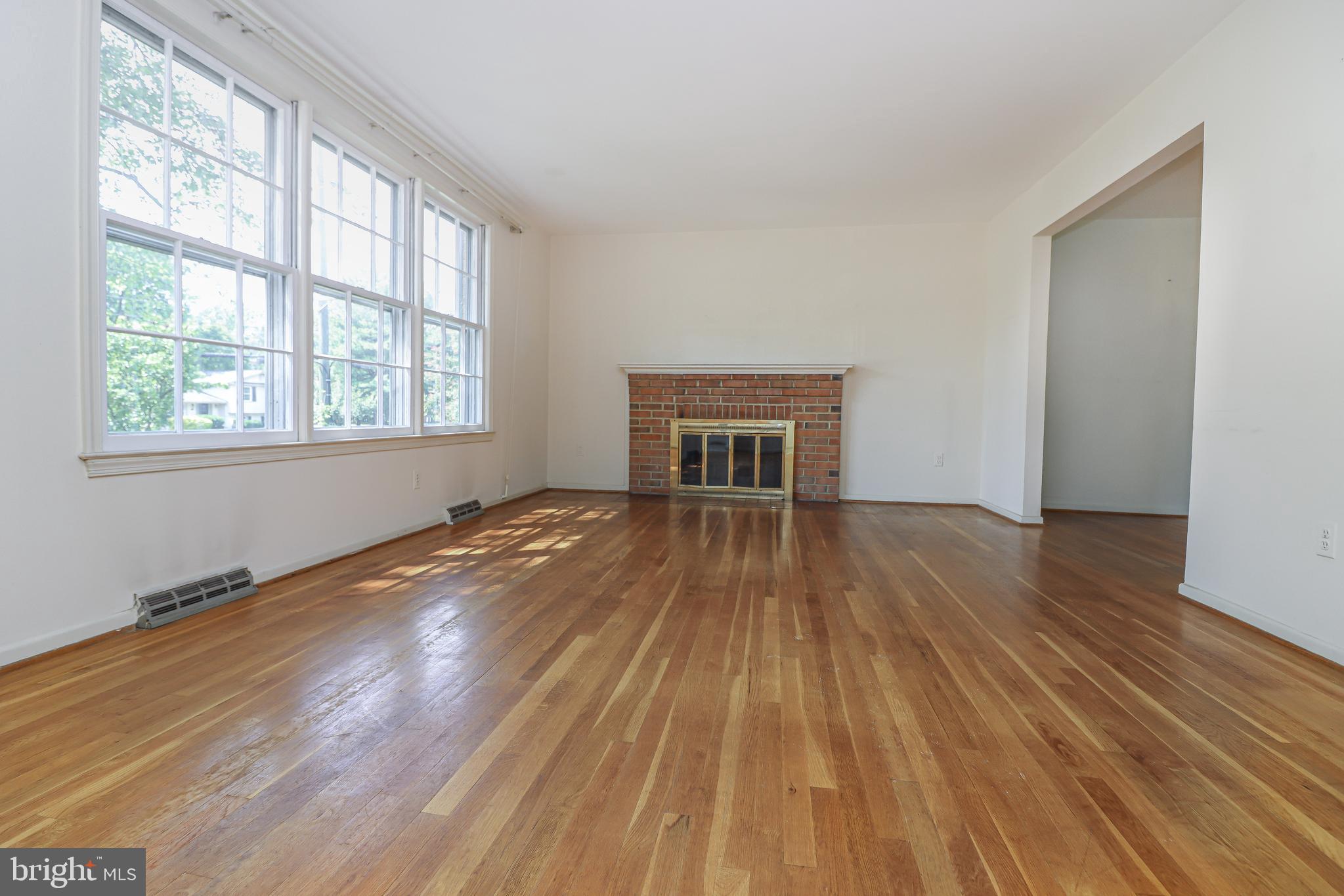 8728 Old Courthouse Road Vienna, VA 22182 - Photo 12 of 58 Living Room with Wood Burning Fireplace