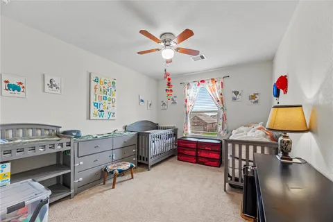 a bedroom with a workspace