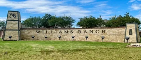 a view of outdoor space with garden and trees