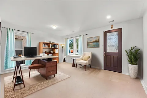 a workspace with furniture and window