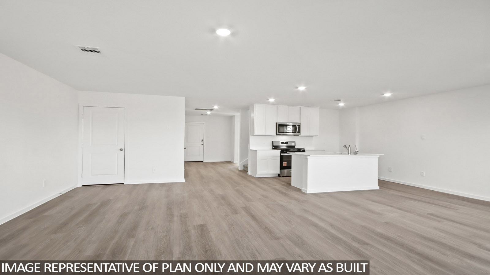 144 Baby Calf Roping Road Jarrell, TX 76537 - Photo 5 of 20 a view of kitchen with kitchen island wooden floors and stainless steel appliances